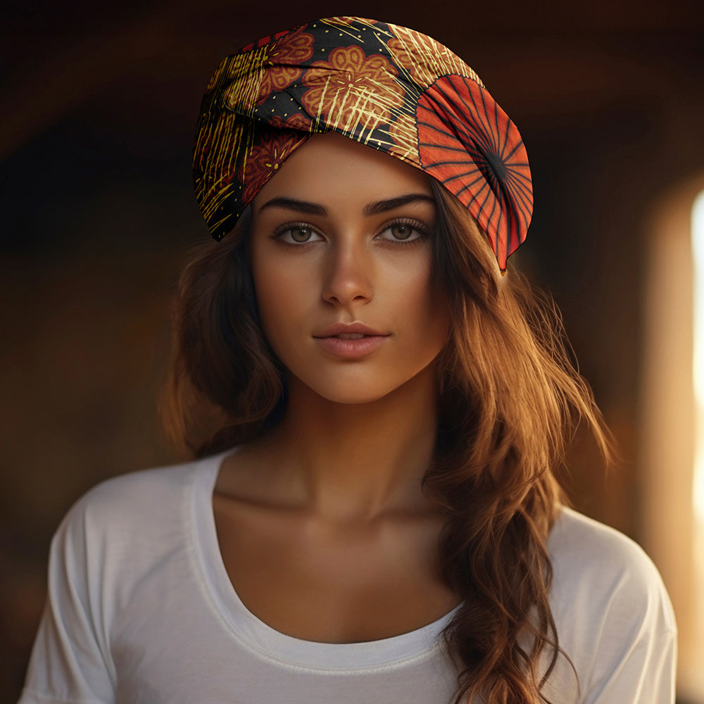 Brown and orange floral African print headwrap for natural, curly, and coily hair – lightweight fabric with geometric design.